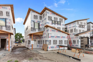 Modern kit homes are assembled using traditional techniques with modern technology