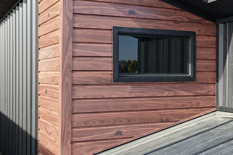 A closeup of a milgard window installed in a kit home