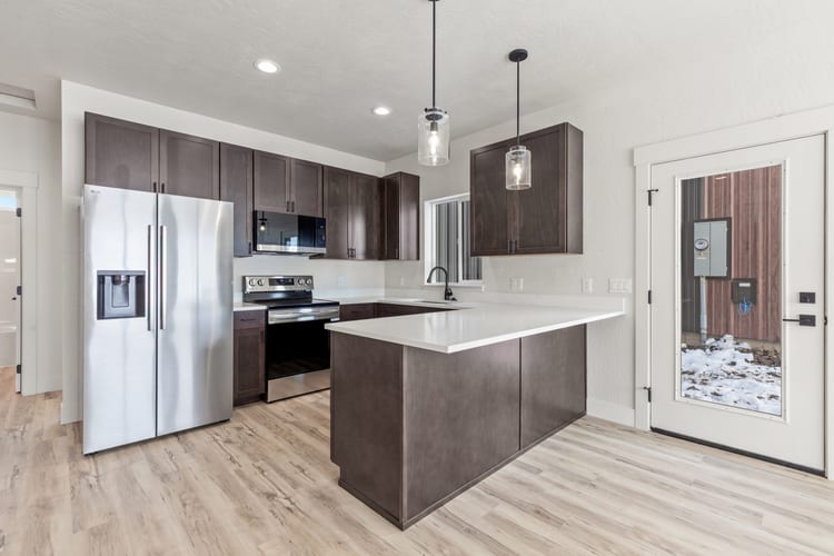 Spacious kitchen inside a Kit Culture Cottage model, the interior finish level on kit homes for sale from Kit Culture