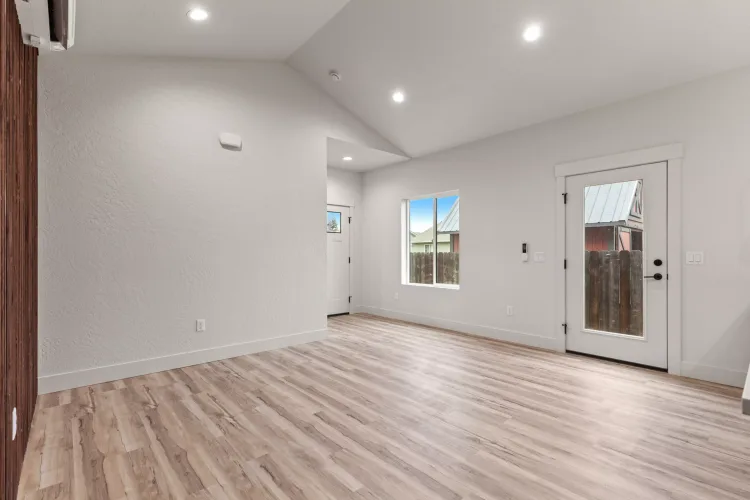 Open living area with a vaulted ceiling, the interior finish level to expect when you vet ADU builders