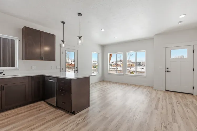 Kitchen with quartz counters in a compact cottage, the finish level micro home kits from Kit Culture include
