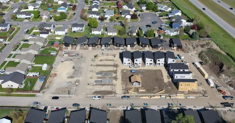Aerial view of an Idaho neighborhood built from kits, showing prefab homes for sale nearby at neighborhood scale
