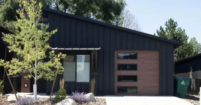Street of modern kit homes in an Idaho development, built as prefab homes low cost per unit at scale