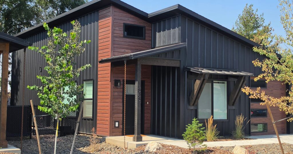 Finished black and white kit home in Idaho, the result that prefab homes prices only partly cover
