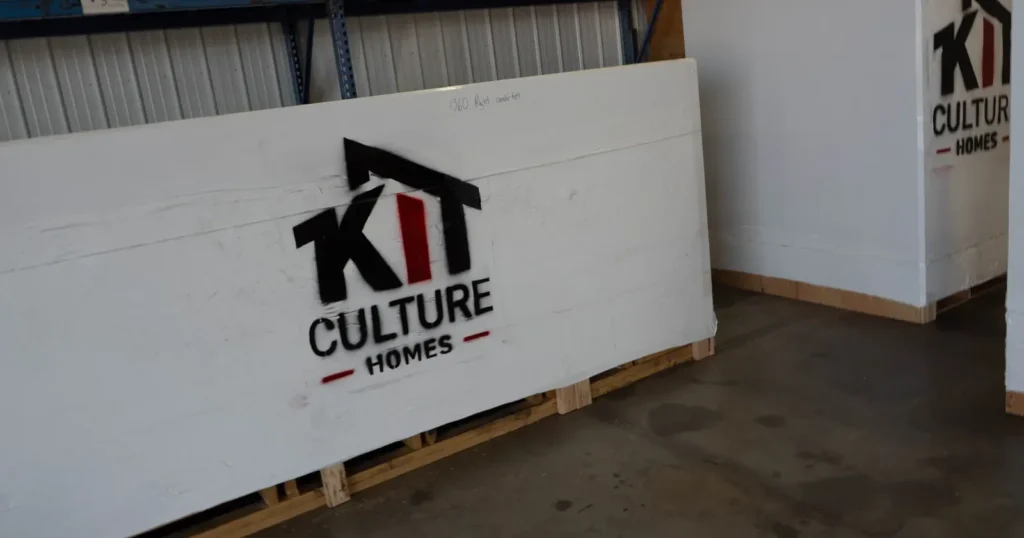 Components for prefabricated house kits packed in labeled weatherproof boxes ready for delivery