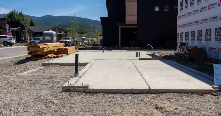 Concrete foundation poured before framing, the site work prefab home kits don't include
