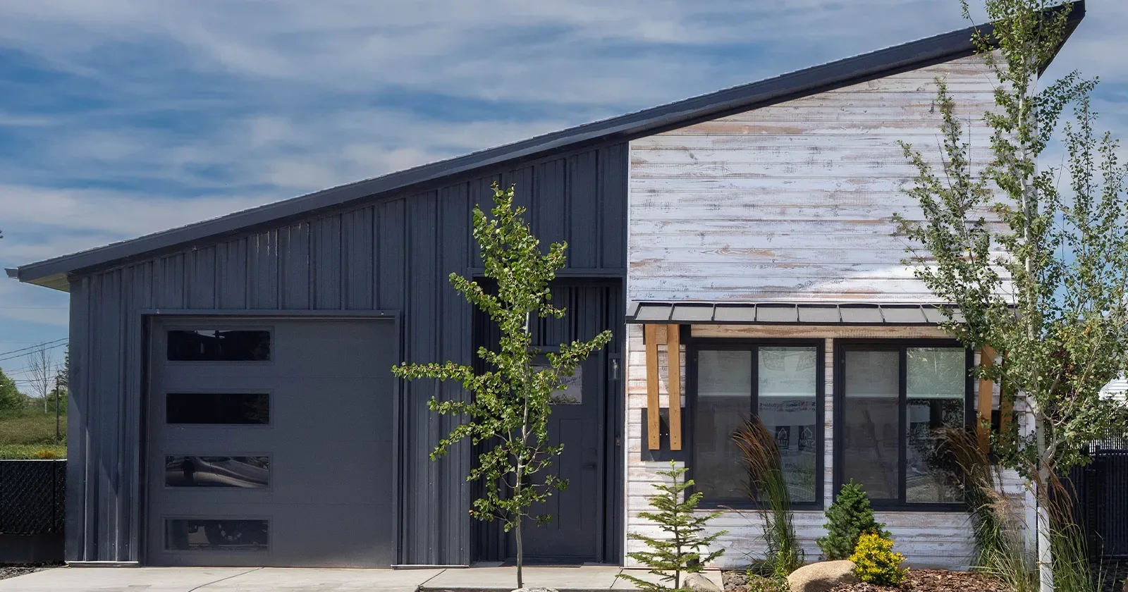 Black and white kit home in Idaho, the finished result that prefab home kits prices only partly cover