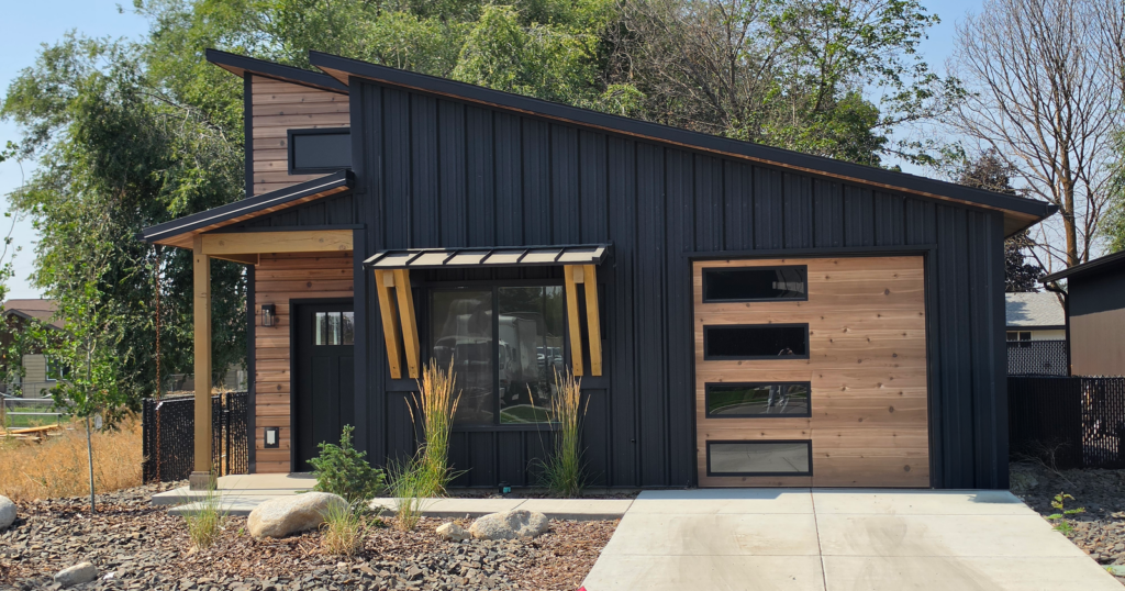 Black exterior of a Kit Culture home on a permanent foundation in Idaho, built from prefab home kits