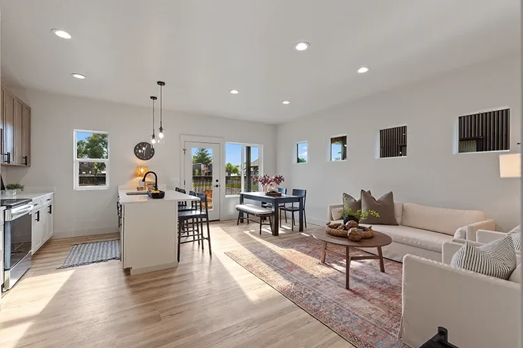 Open interior of a compact Cottage kit home, room that tiny home builders can't fit under 400 square feet